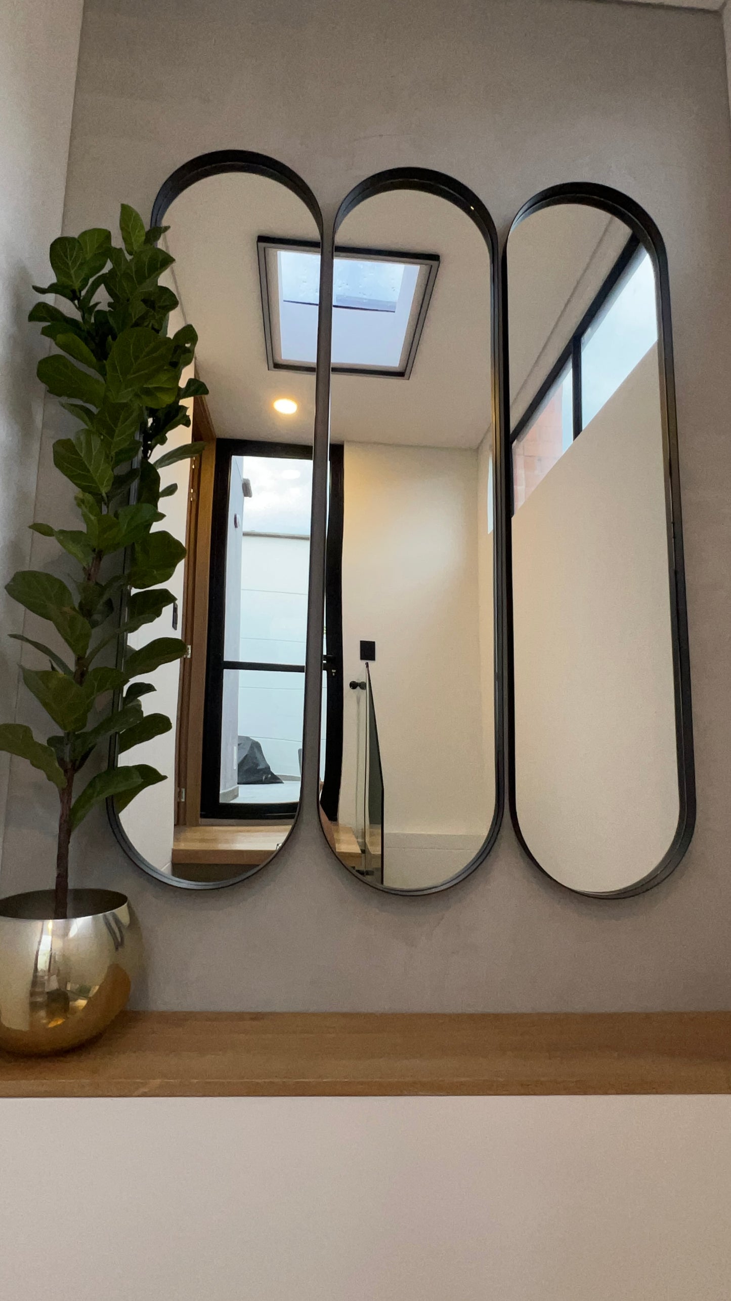 Espejo Felix con marco metálico